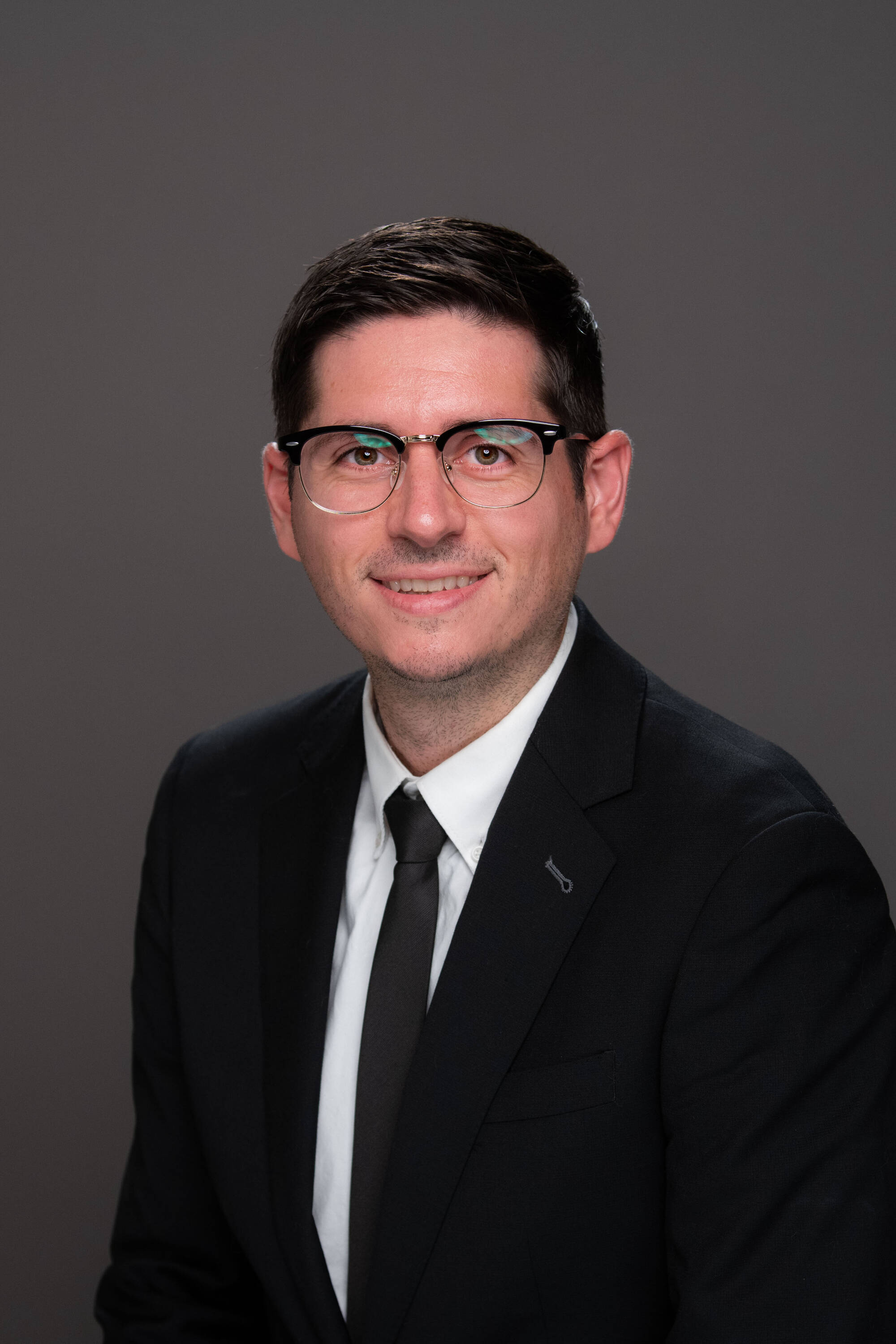 Nick Woodward wearing a black and white suit